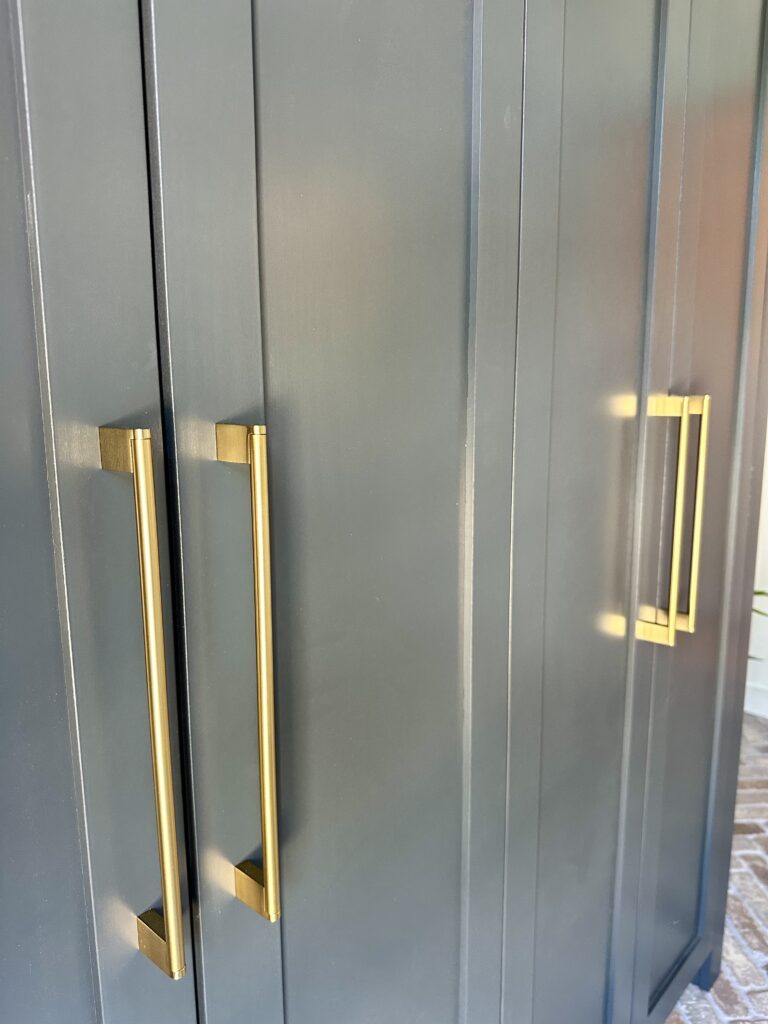Dropzone cabinets with honey bronze pulls